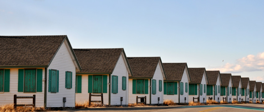 A row of boarded up cottages on Rt. 6A, between Provincetown and Truro, Massachusetts, on a January day